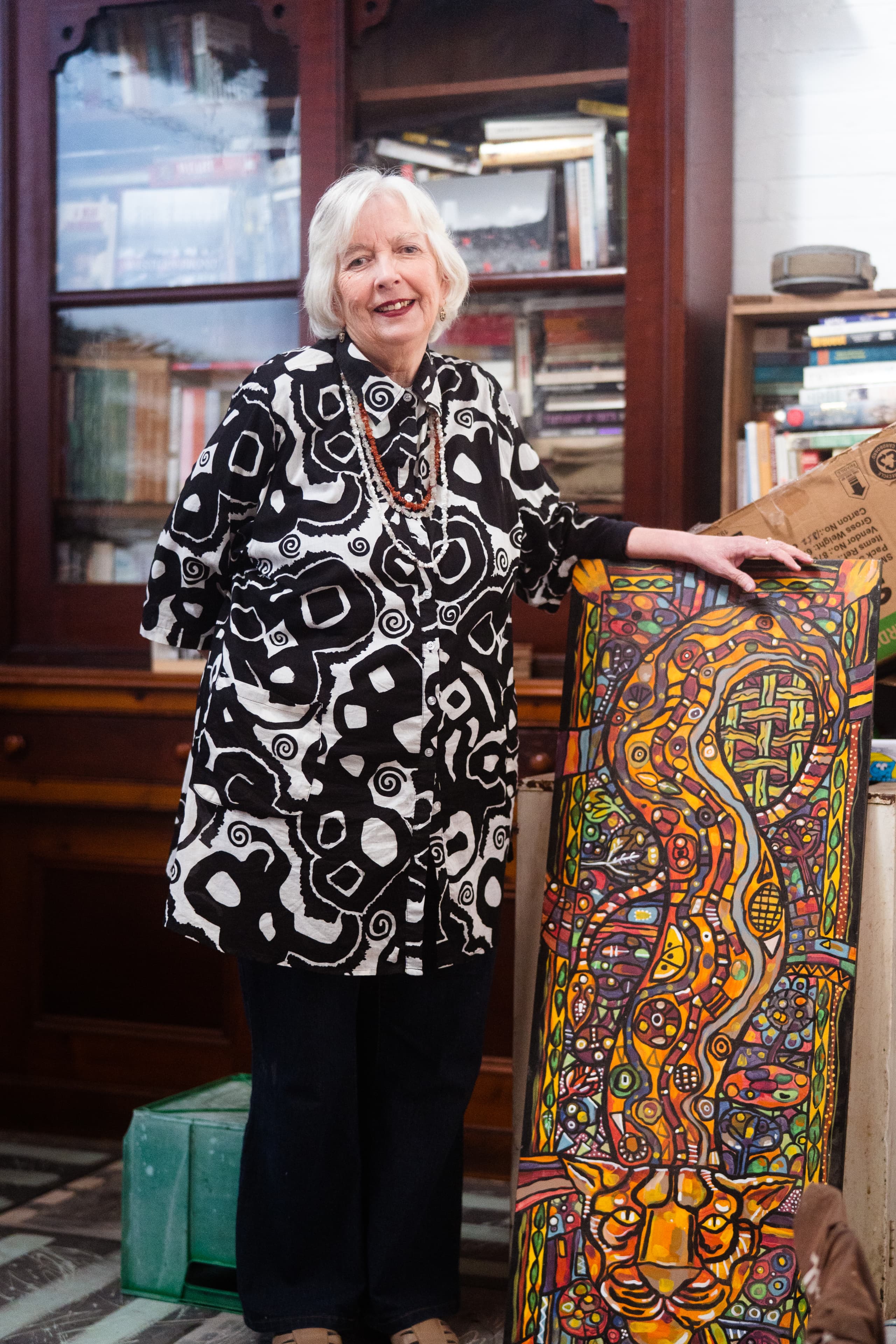 Judith, BreastScreen Australia interview portrait with her painted artwork, artistic environment, documentary cinematography by Mude for the Department of Health government creative campaign